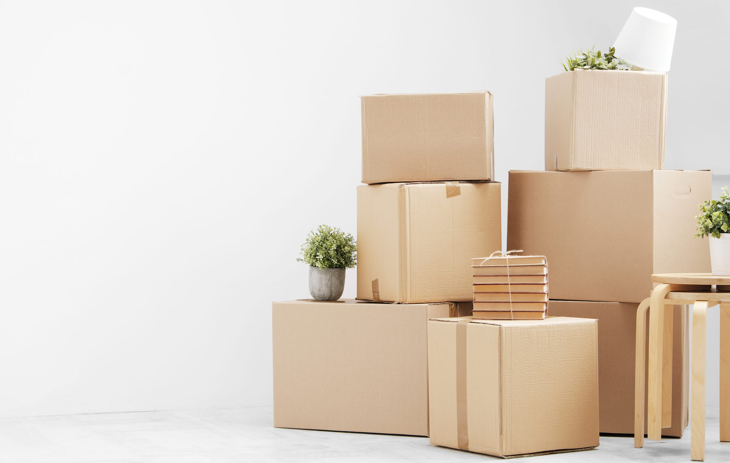 Moving,To,A,New,Home.,Belongings,In,Cardboard,Boxes,,Books